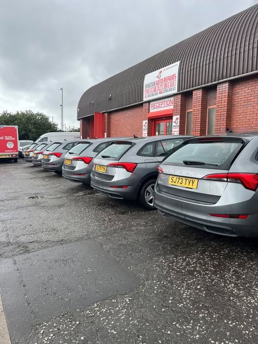 Cars lined up outside the Spartan Auto Repair workshop