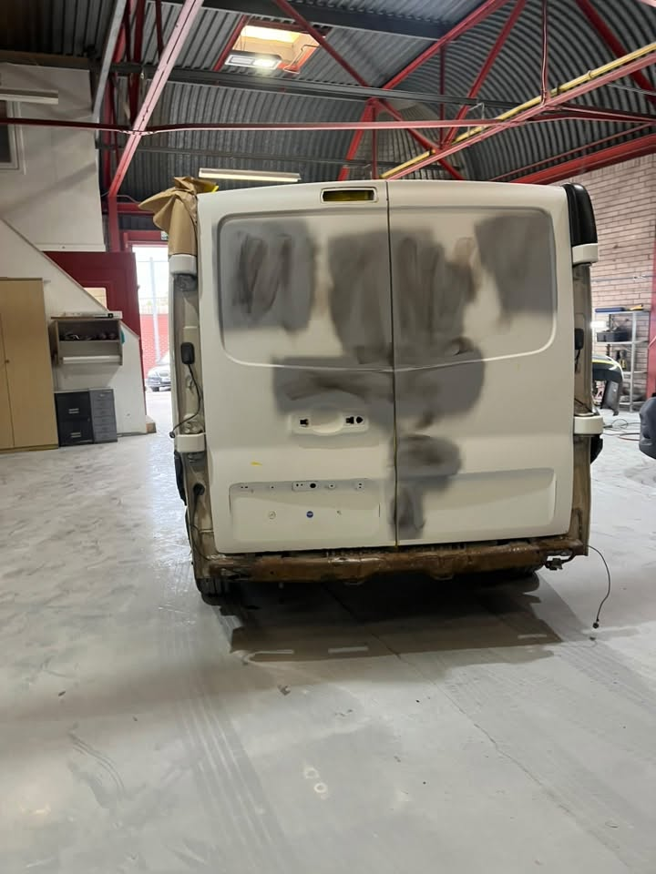 Van mid-repair in the Spartan Auto Repair workshop